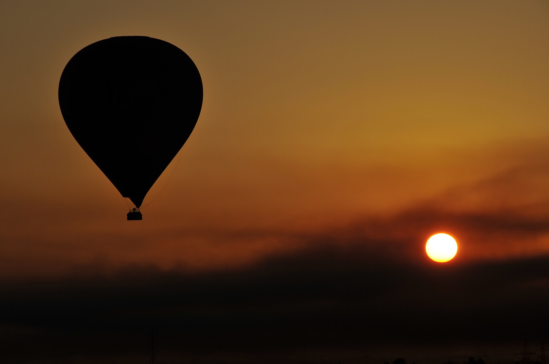 Hot-air balloon flying over the Nile and temples at Luxor, Egypt